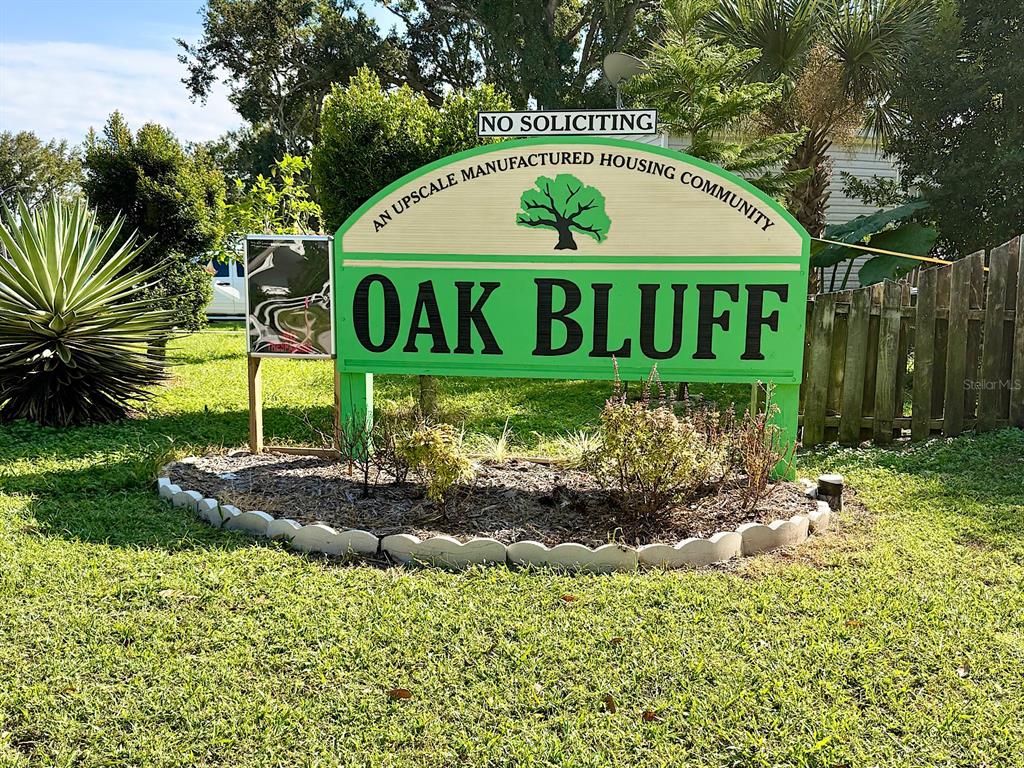 1099 Yaupon Street Daytona Beach, FL 32117 - Photo 2 of 4 a sign on the side of the road