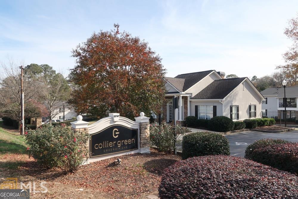 1150 Collier Road Northwest, Unit H9 Atlanta, GA 30318 - Photo 1 of 13 a front view of a house with a garden