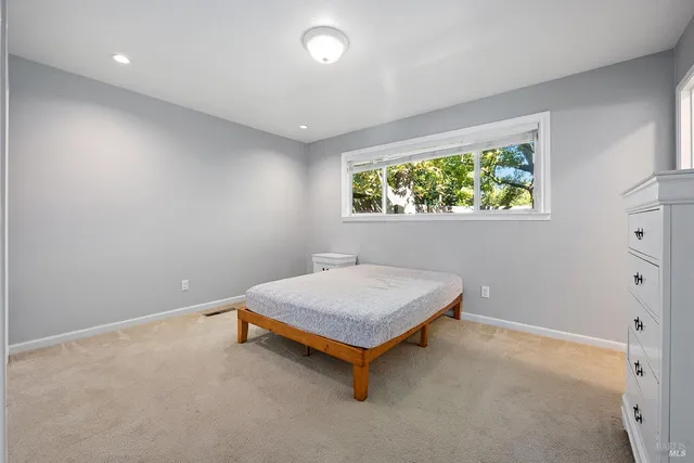 a room with pool table and a window