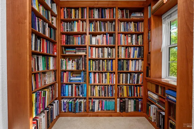 a view of a book shelf with lots of books