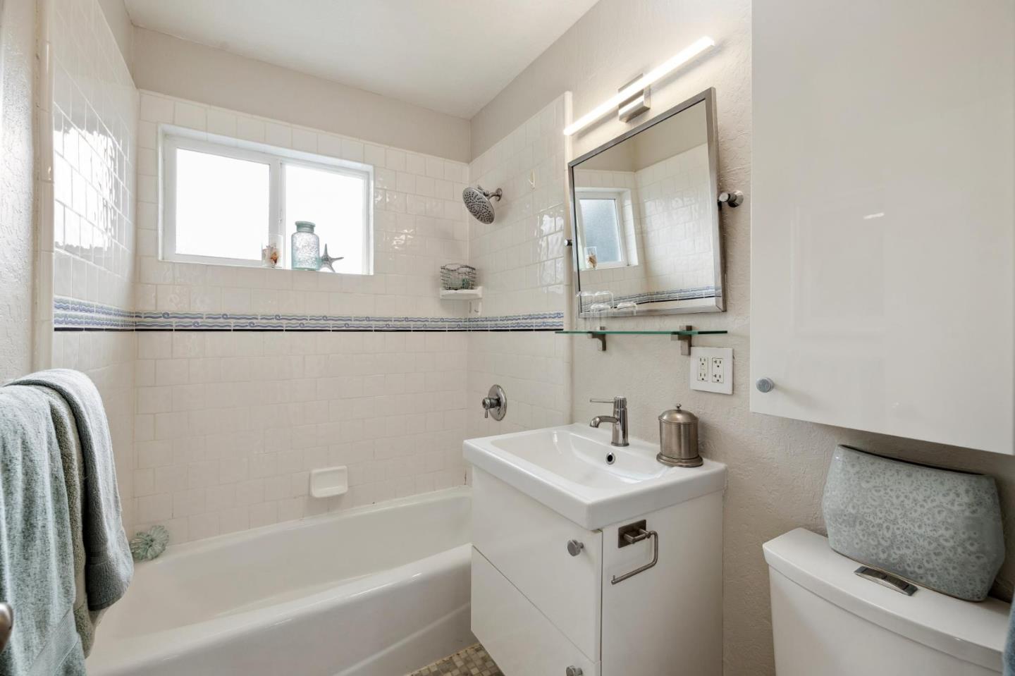 741 Emily Drive Mountain View, CA 94043 - Photo 18 of 30 a bathroom with a sink mirror and a bathtub