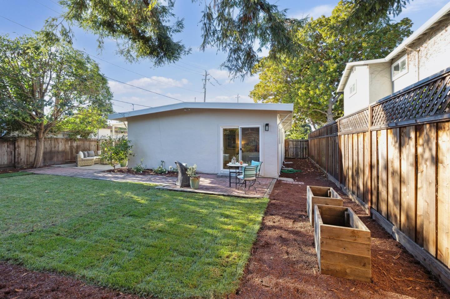 741 Emily Drive Mountain View, CA 94043 - Photo 26 of 30 a view of a house with backyard and sitting area