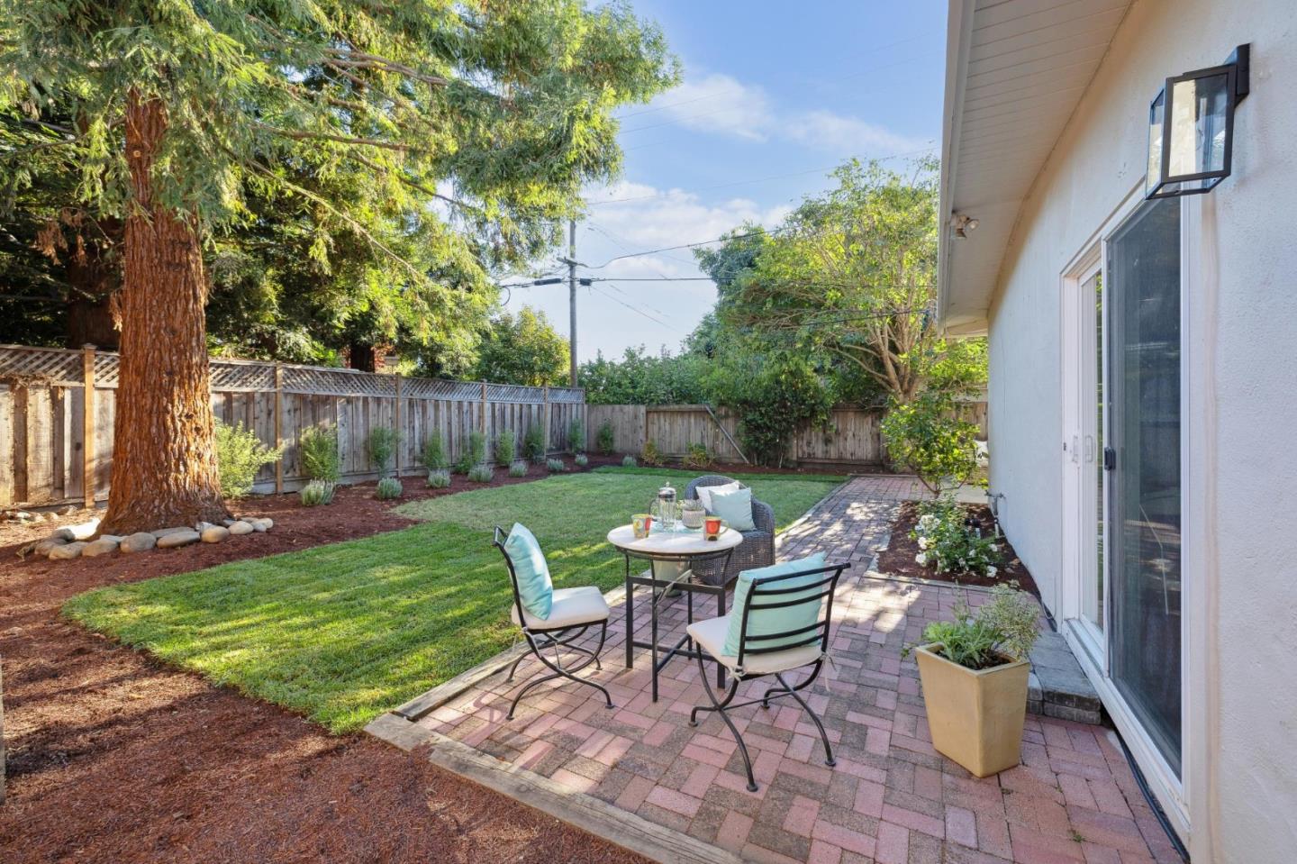 741 Emily Drive Mountain View, CA 94043 - Photo 27 of 30 a view of a table and chairs in back yard of the house