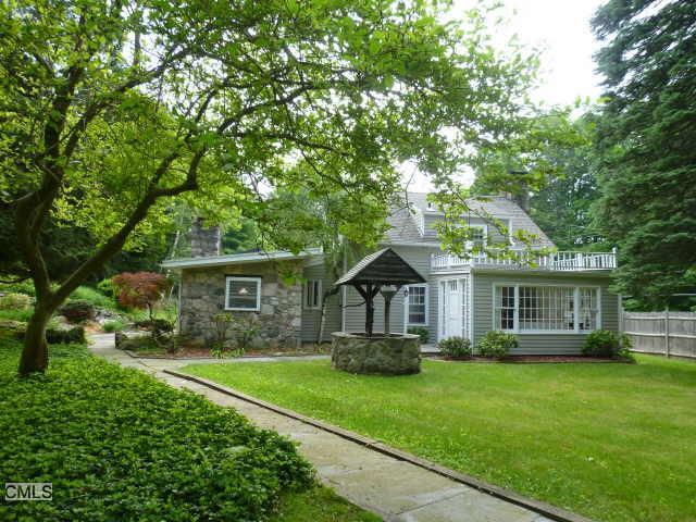 194 George Washington Highway Ridgefield, CT 06877 - Photo 1 of 1 a front view of house with yard and green space