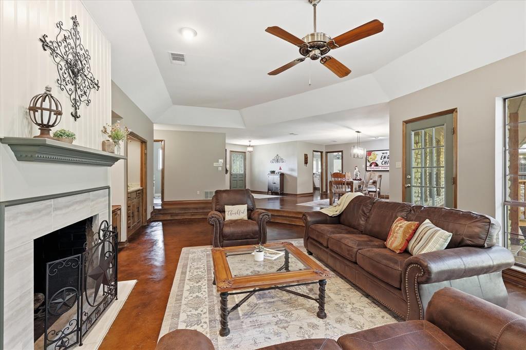 1904 Oak Ridge Trail Bridgeport, TX 76426 - Photo 10 of 40 a living room with furniture a fireplace and a table