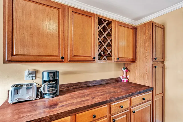 a kitchen with stainless steel appliances a sink stove and cabinets