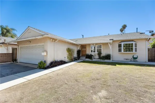 a front view of a house with yard