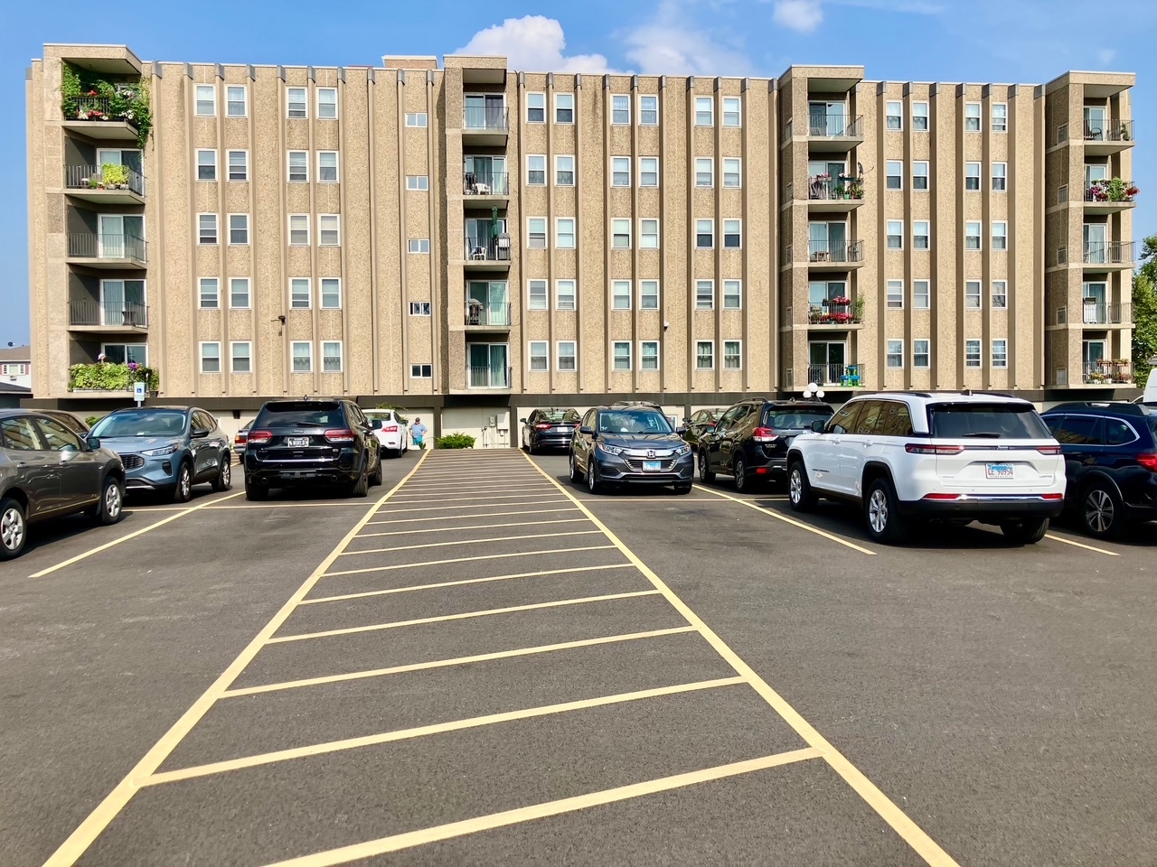 9514 Lawrence Avenue, Unit 2204 Schiller Park, IL 60176 - Photo 1 of 8 a view of a balcony with filled with furniture and large windows