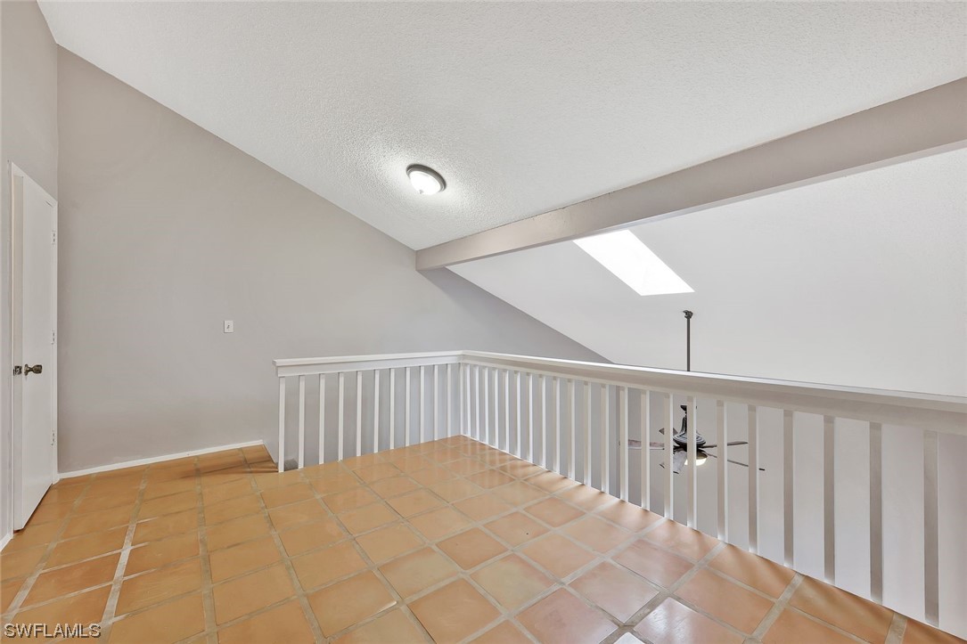 13373 Broadhurst Loop Fort Myers, FL 33919 - Photo 12 of 25 a bedroom with a bed and wooden floor