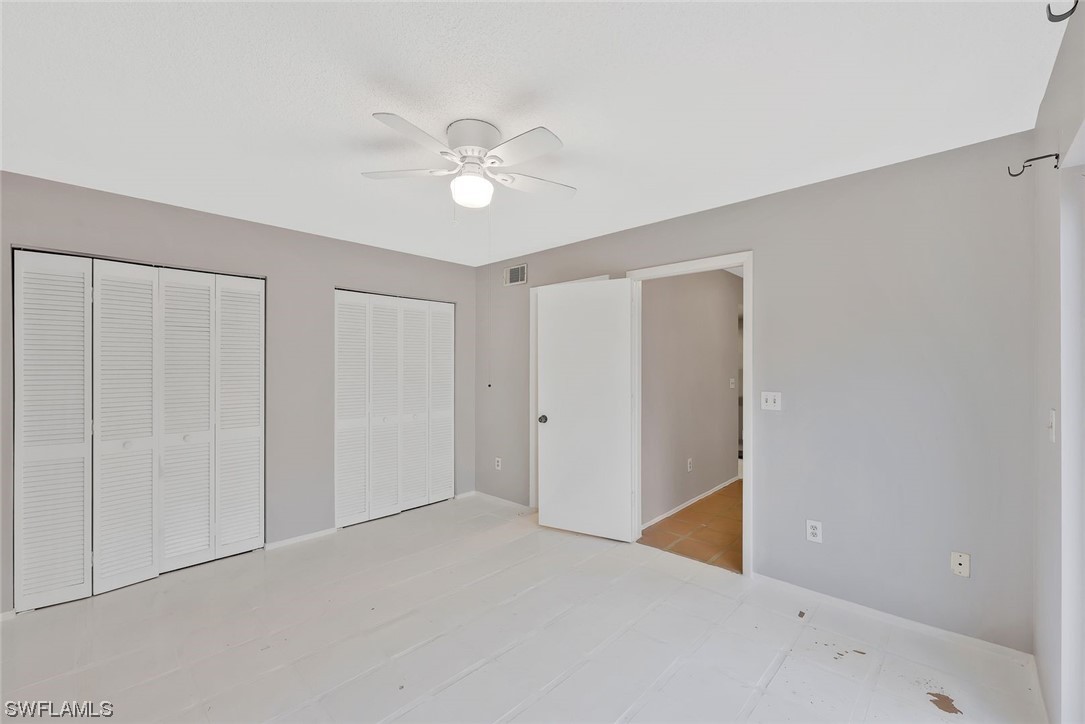 13373 Broadhurst Loop Fort Myers, FL 33919 - Photo 14 of 25 a view of an empty room with a ceiling fan
