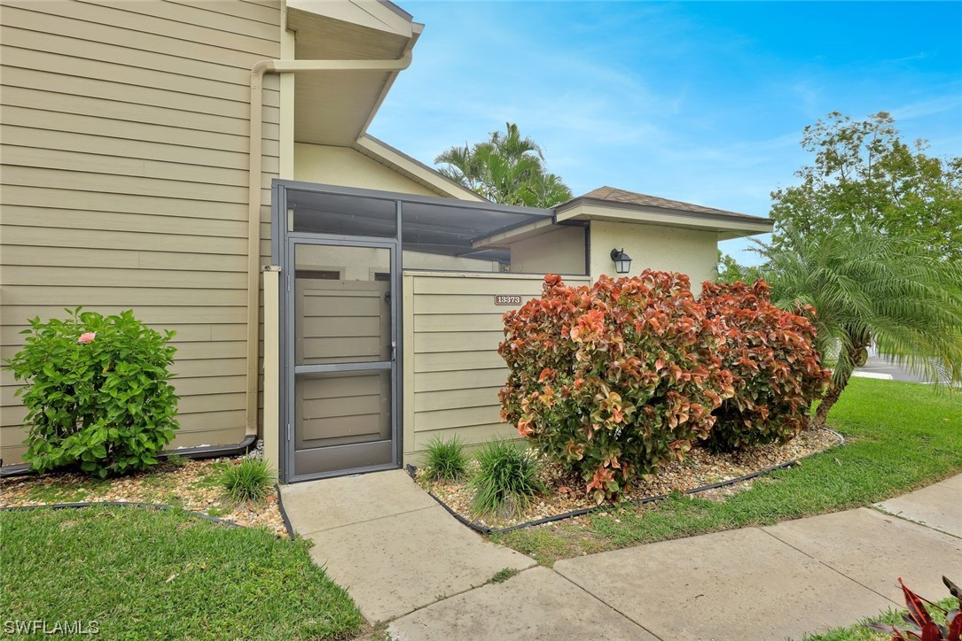 13373 Broadhurst Loop Fort Myers, FL 33919 - Photo 2 of 25 a front view of a house with garden