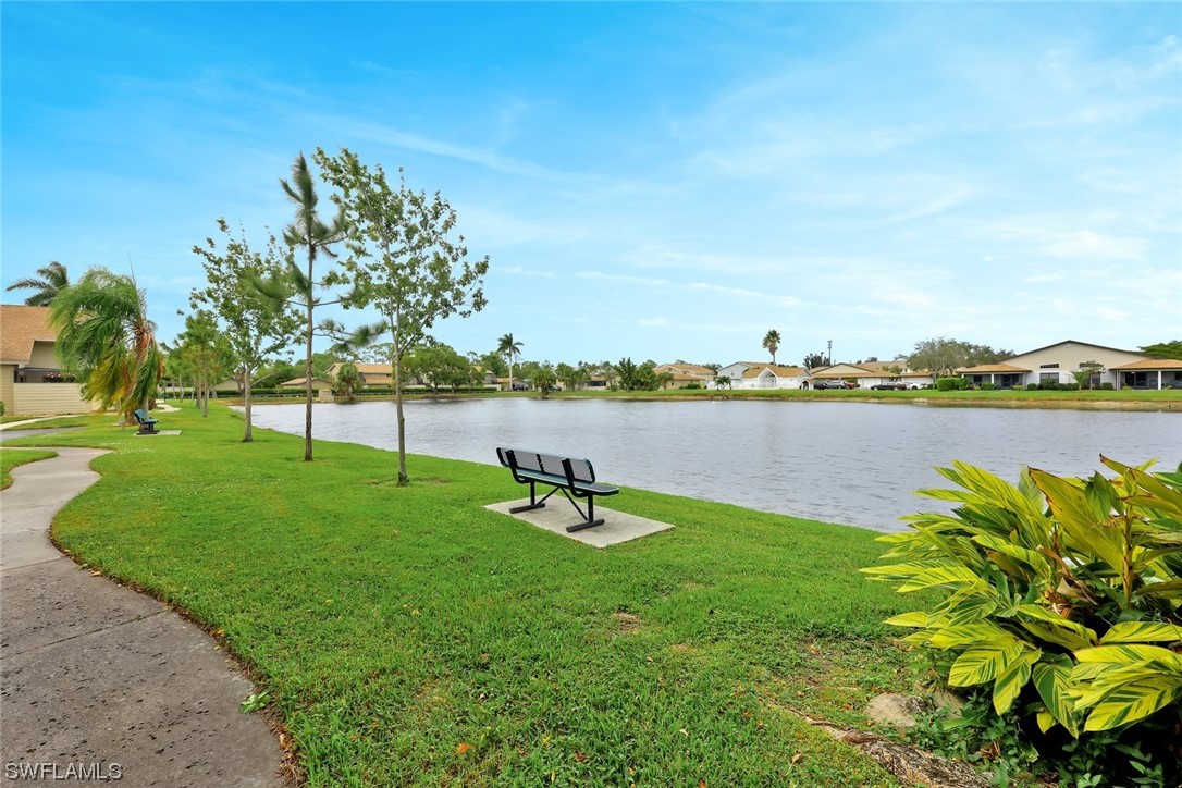 13373 Broadhurst Loop Fort Myers, FL 33919 - Photo 22 of 25 a view of a lake with houses in the back