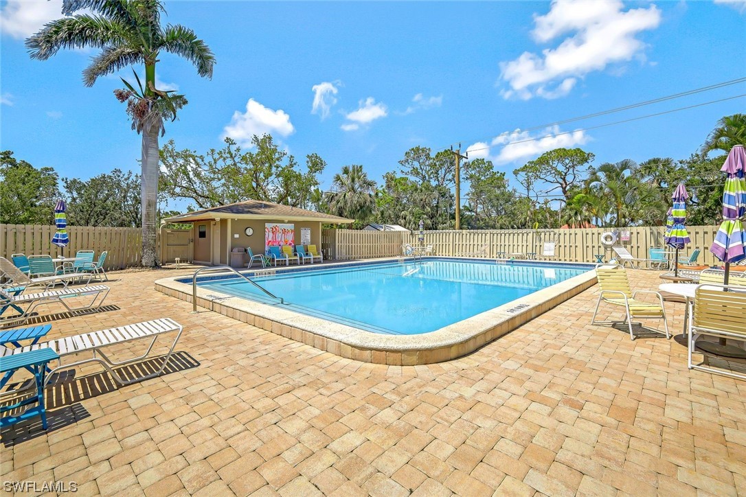 13373 Broadhurst Loop Fort Myers, FL 33919 - Photo 24 of 25 a view of a swimming pool with sitting area