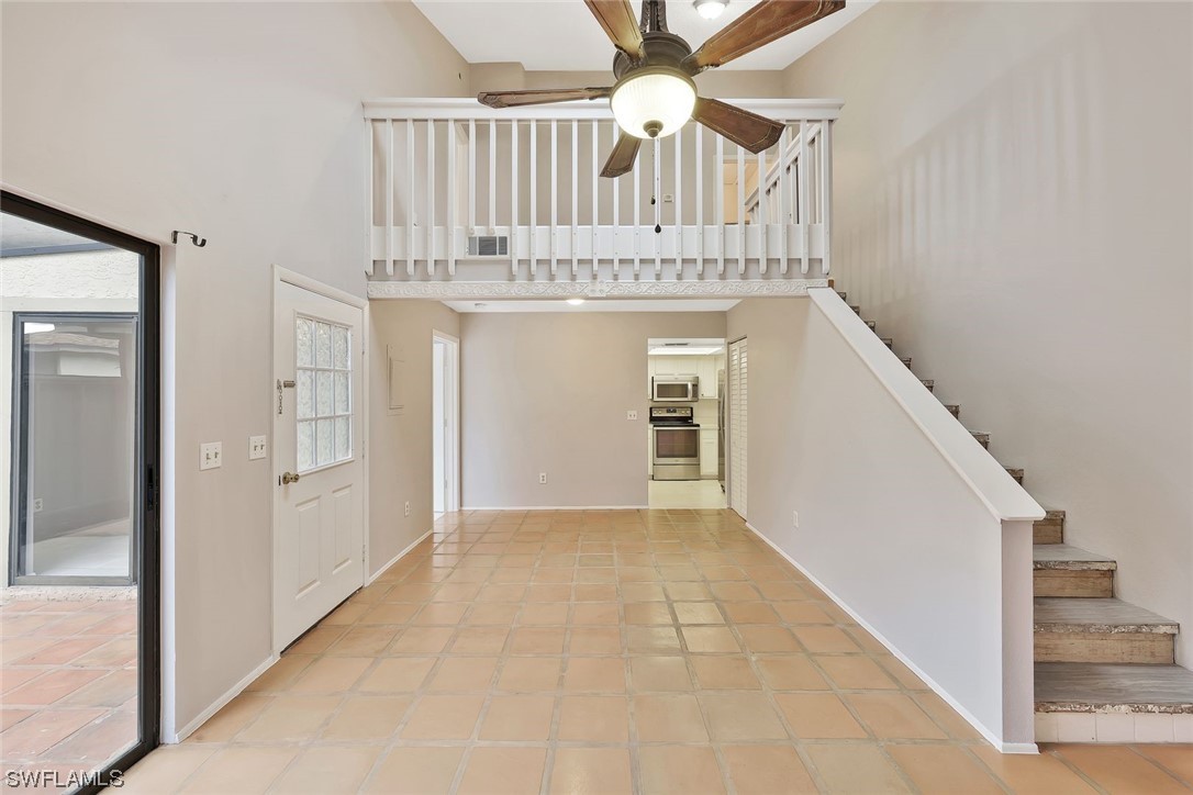13373 Broadhurst Loop Fort Myers, FL 33919 - Photo 3 of 25 a view of a hallway with a kitchen