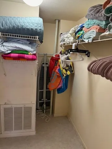 a bedroom with a bed and a lamp