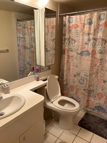 a view of a balcony with table and chairs