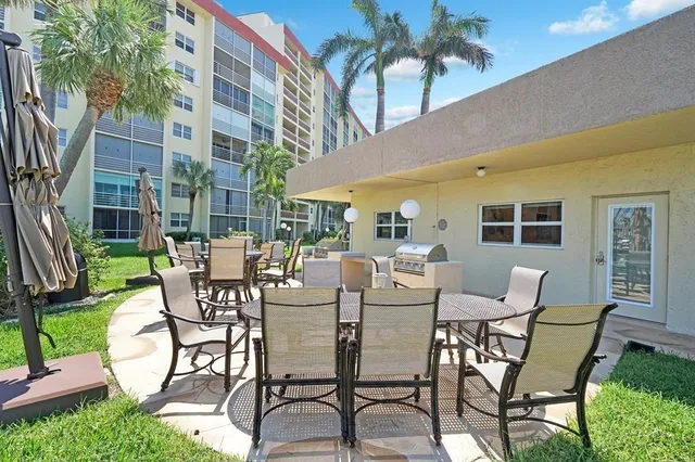 an aerial view of a house a yard and outdoor seating