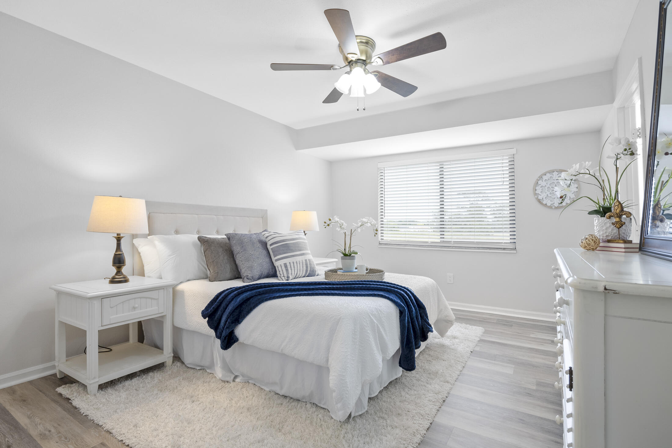 1180 Mascot Street Northeast Palm Bay, FL 32905 - Photo 13 of 24 a bedroom with a large bed and a chandelier