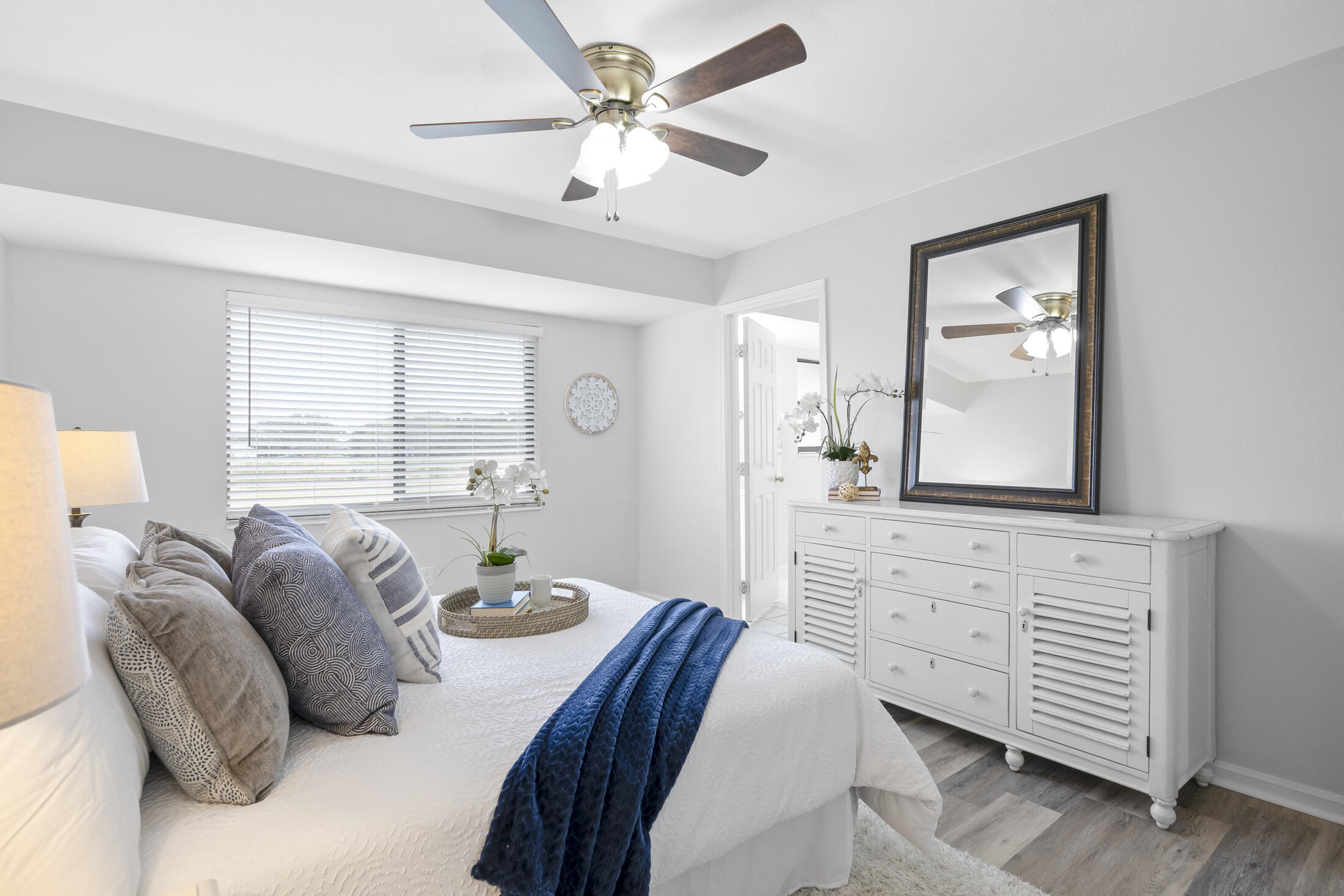 1180 Mascot Street Northeast Palm Bay, FL 32905 - Photo 14 of 24 a living room with furniture two window and a potted plant