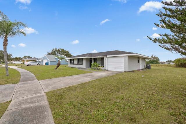 1180 Mascot Street Northeast Palm Bay, FL 32905 - Photo 2 of 24 a view of outdoor space yard and swimming pool