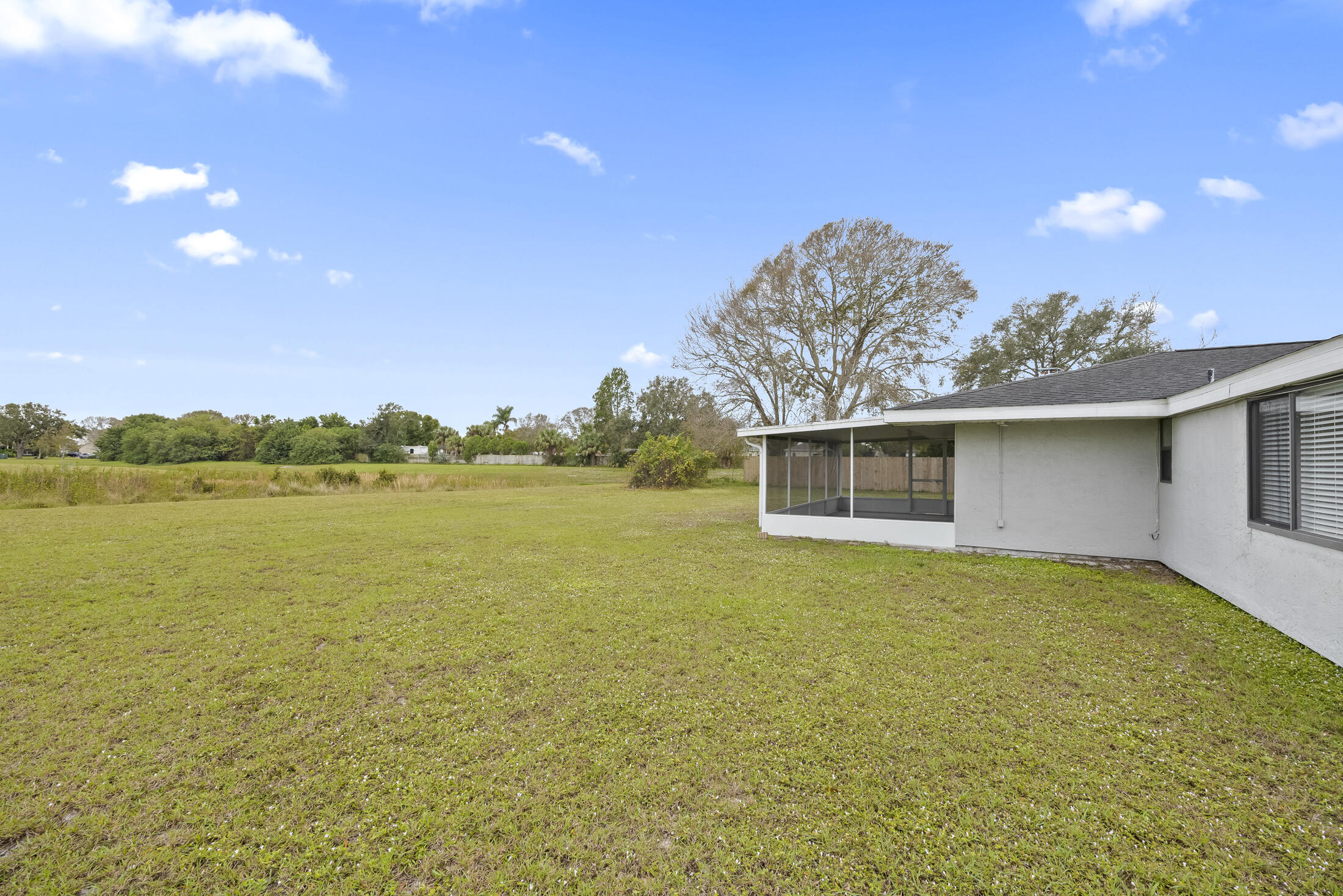 1180 Mascot Street Northeast Palm Bay, FL 32905 - Photo 23 of 24 a view of a house with a yard