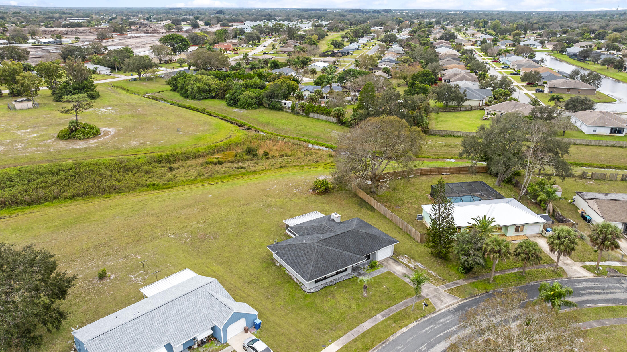1180 Mascot Street Northeast Palm Bay, FL 32905 - Photo 24 of 24 an aerial view of residential houses with outdoor space