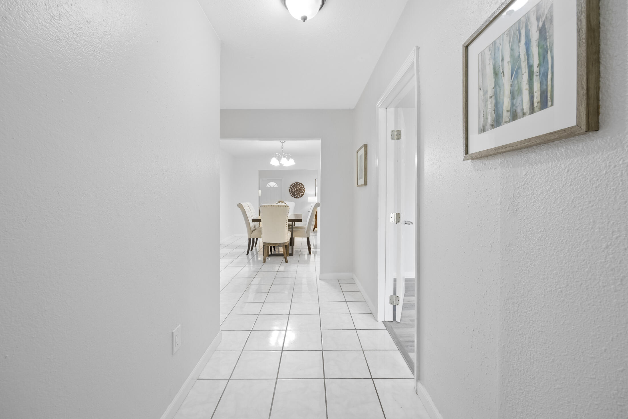 1180 Mascot Street Northeast Palm Bay, FL 32905 - Photo 3 of 24 a view of a room with wooden floor and furniture