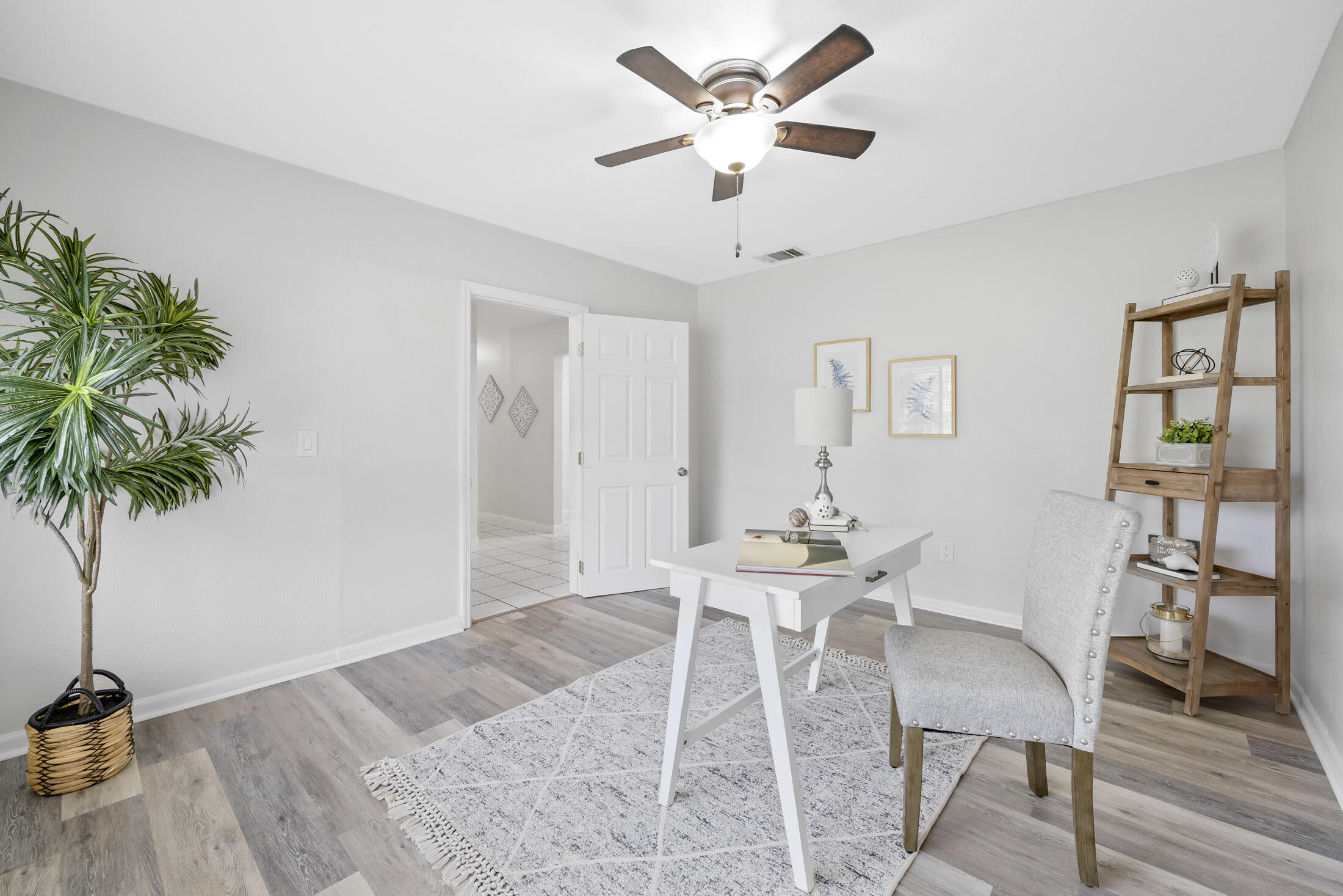 1180 Mascot Street Northeast Palm Bay, FL 32905 - Photo 5 of 24 a view of a livingroom with furniture and a potted plant