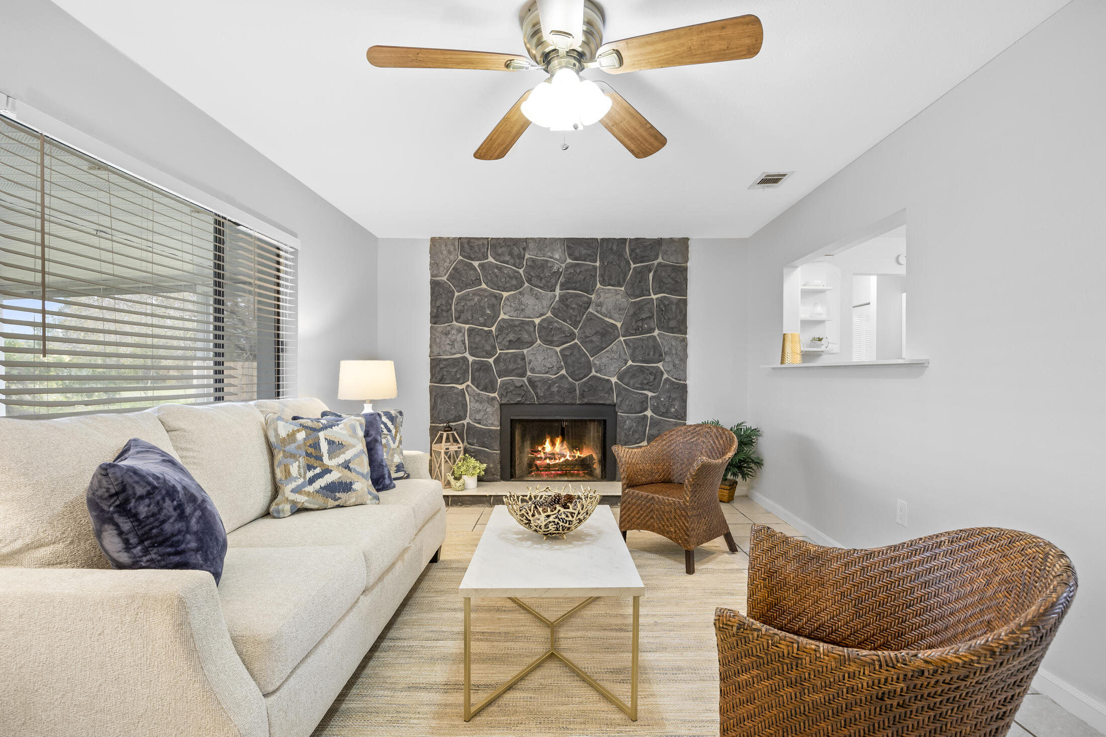 1180 Mascot Street Northeast Palm Bay, FL 32905 - Photo 9 of 24 a living room with furniture and a fireplace