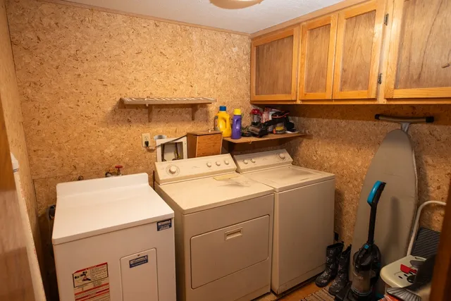 a view of a house with backyard porch and sitting area