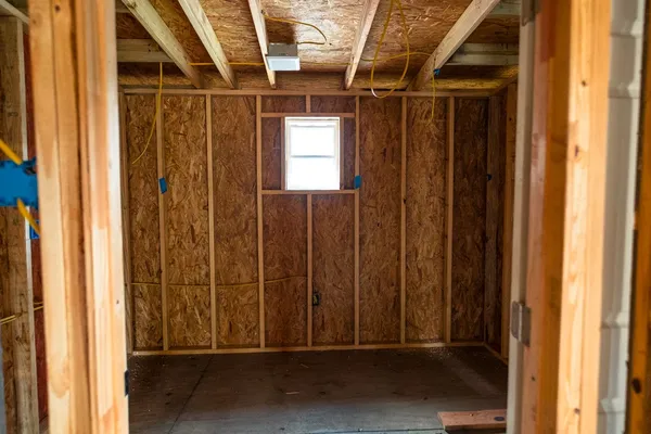 a view of a patio with table and chairs under an umbrella