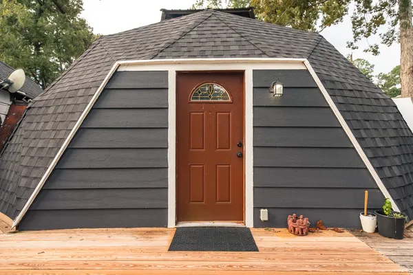a view of outdoor space with deck and kitchen