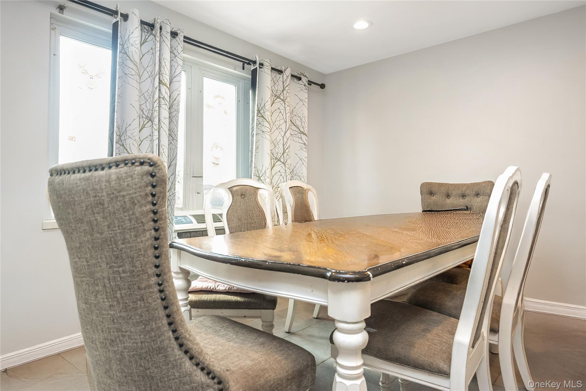 71-59 58th Road Queens, NY 11378 - Photo 11 of 34 a dining room with furniture and window