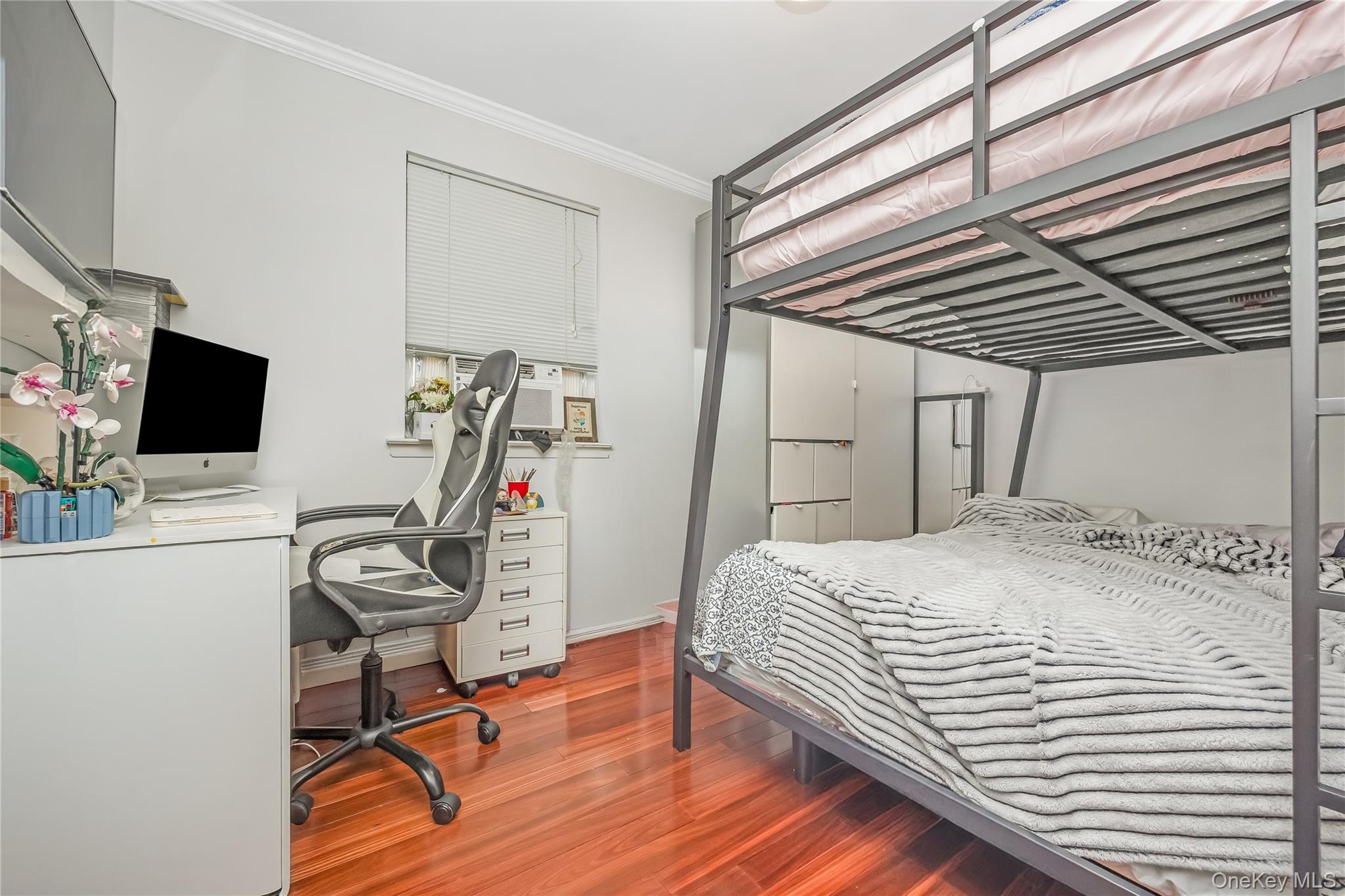 71-59 58th Road Queens, NY 11378 - Photo 16 of 34 a bedroom with a bed and a flat screen tv