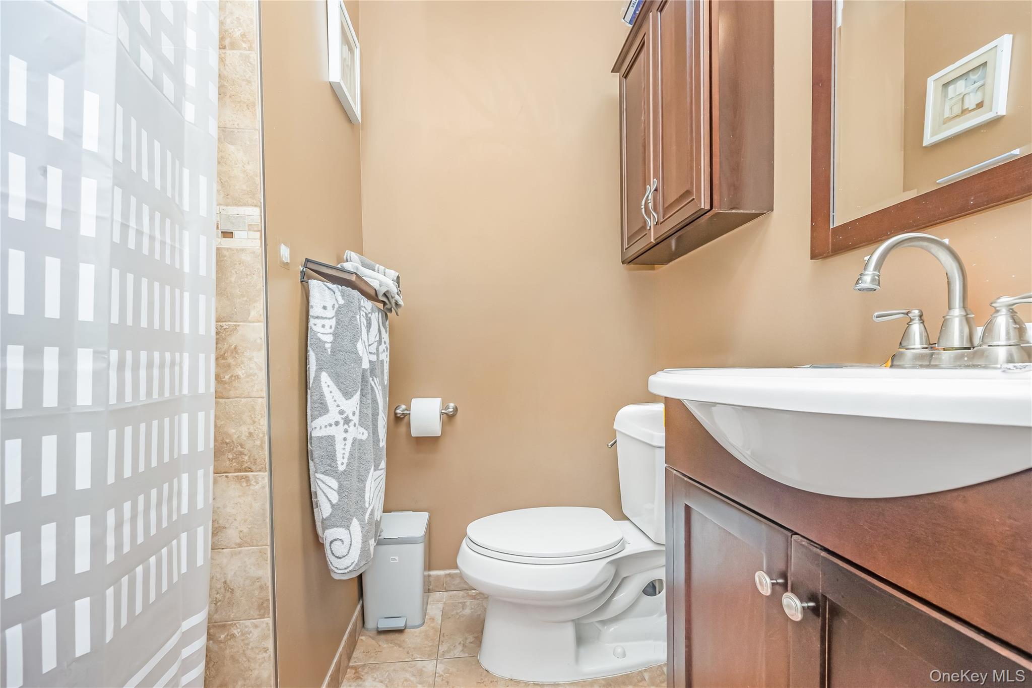 71-59 58th Road Queens, NY 11378 - Photo 20 of 34 a bathroom with a sink toilet and shower