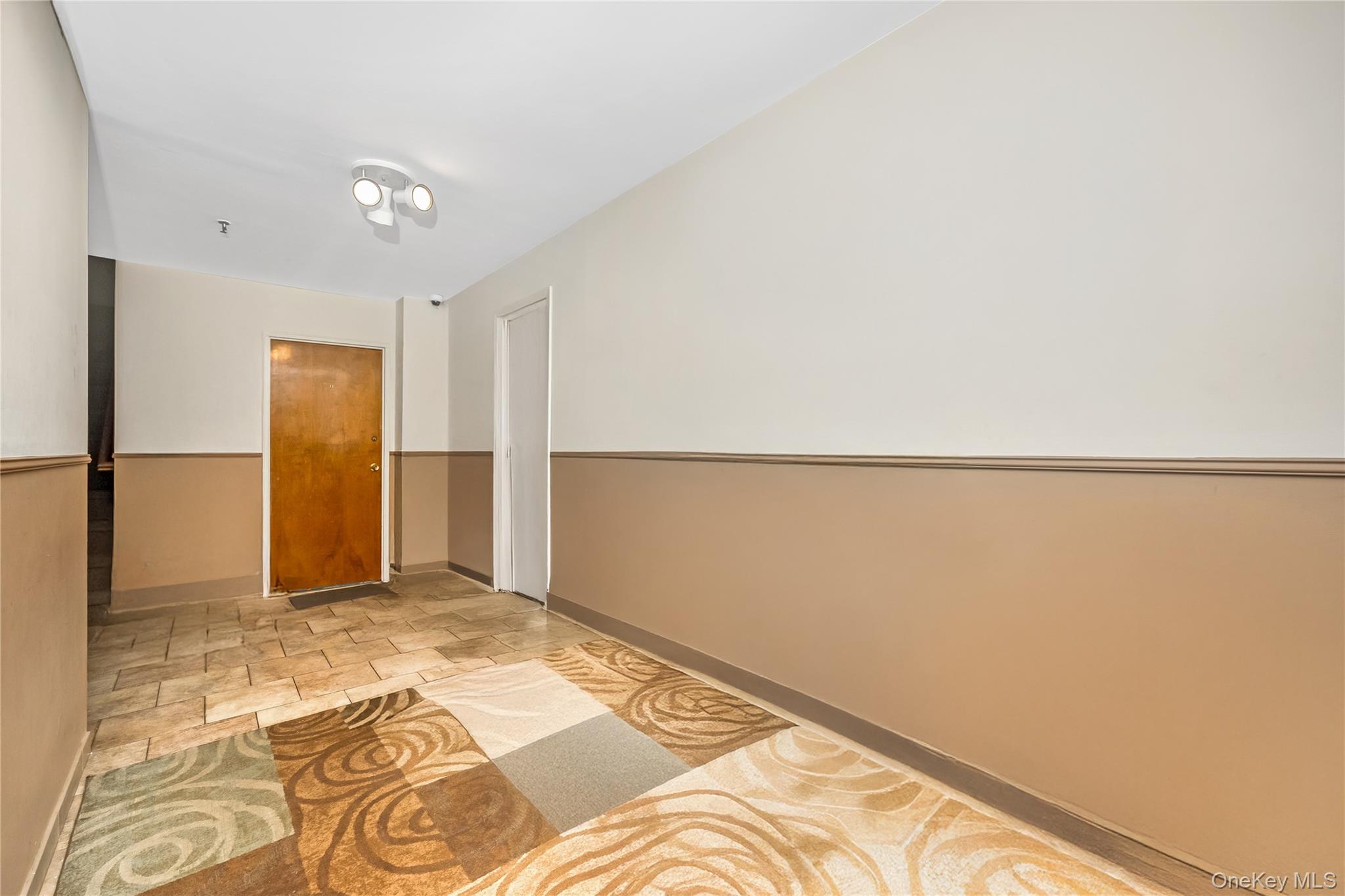 71-59 58th Road Queens, NY 11378 - Photo 2 of 34 a view of a room with an empty space