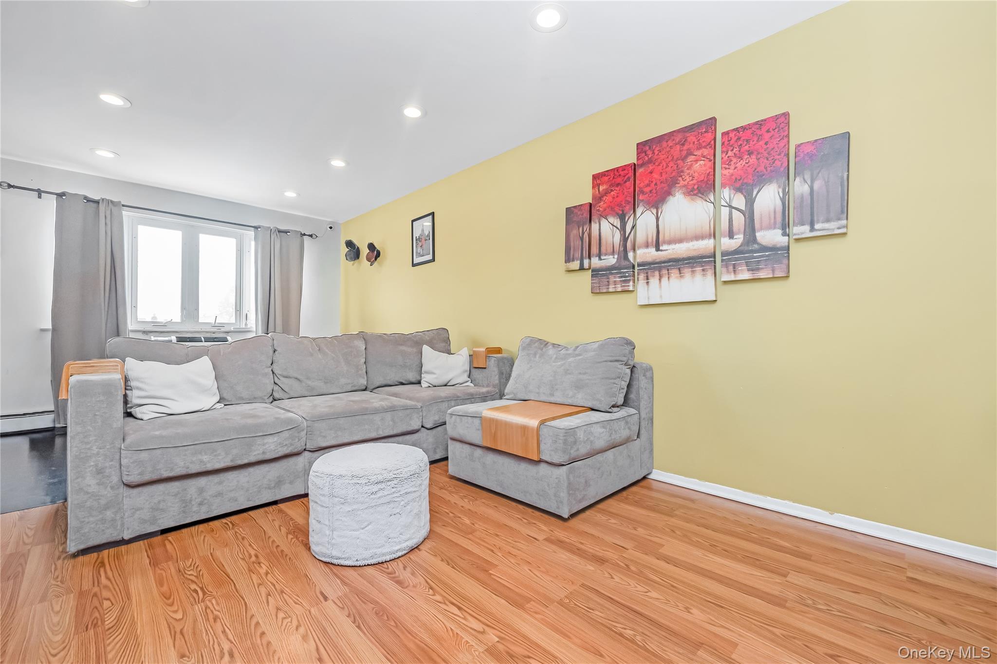 71-59 58th Road Queens, NY 11378 - Photo 21 of 34 a living room with furniture and wooden floor