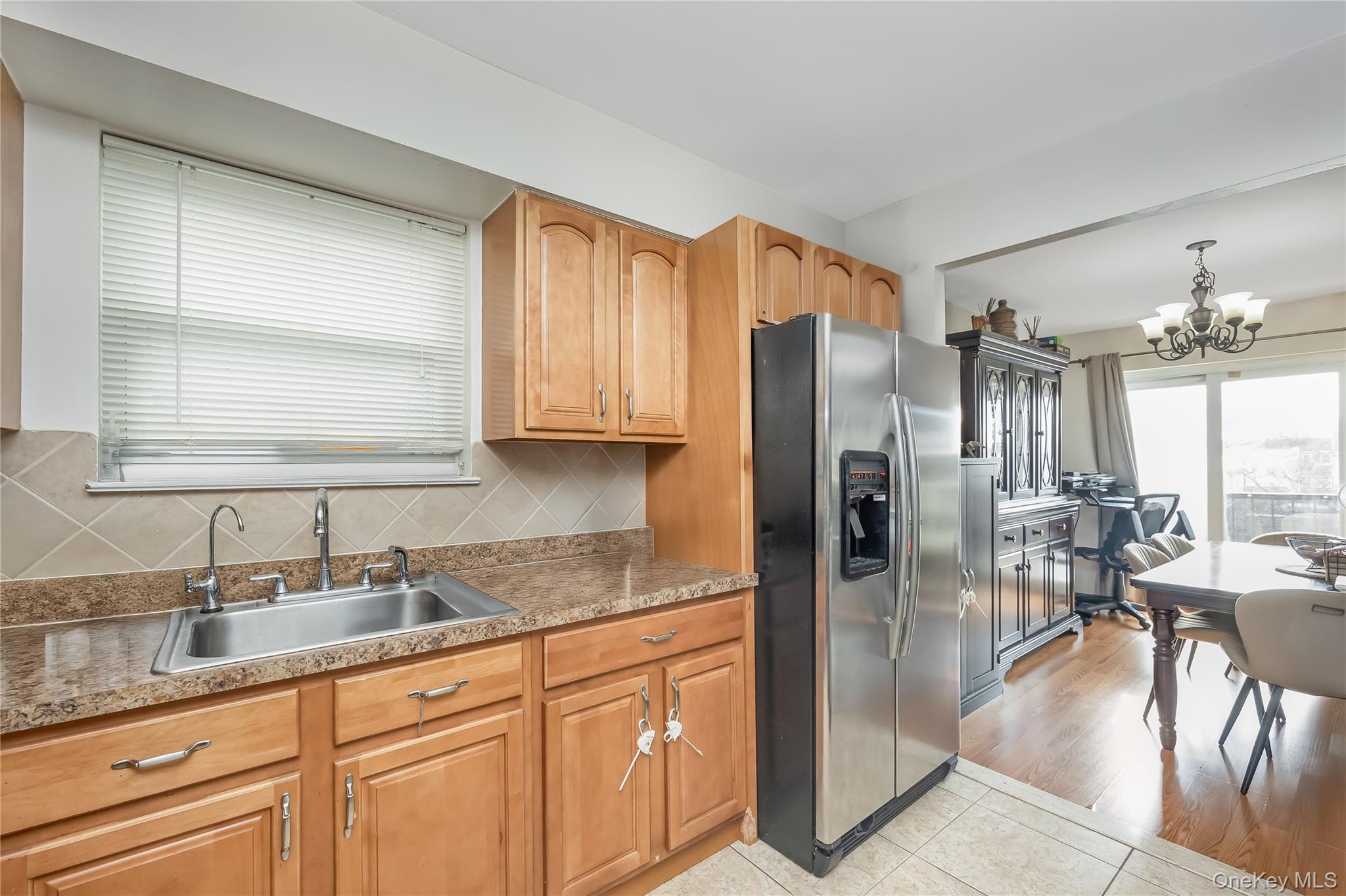 71-59 58th Road Queens, NY 11378 - Photo 26 of 34 a kitchen with stainless steel appliances granite countertop a refrigerator and a sink