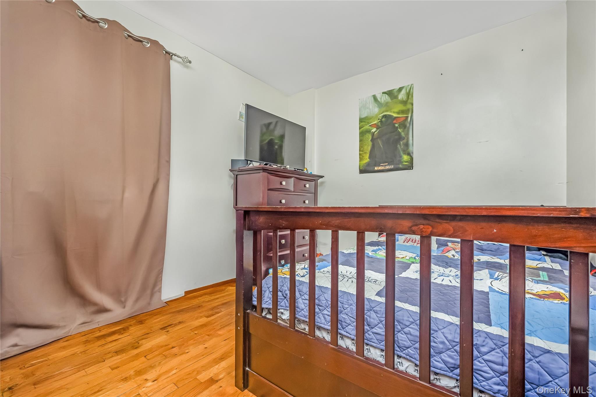 71-59 58th Road Queens, NY 11378 - Photo 27 of 34 a view of a hallway with wooden floor and stairs