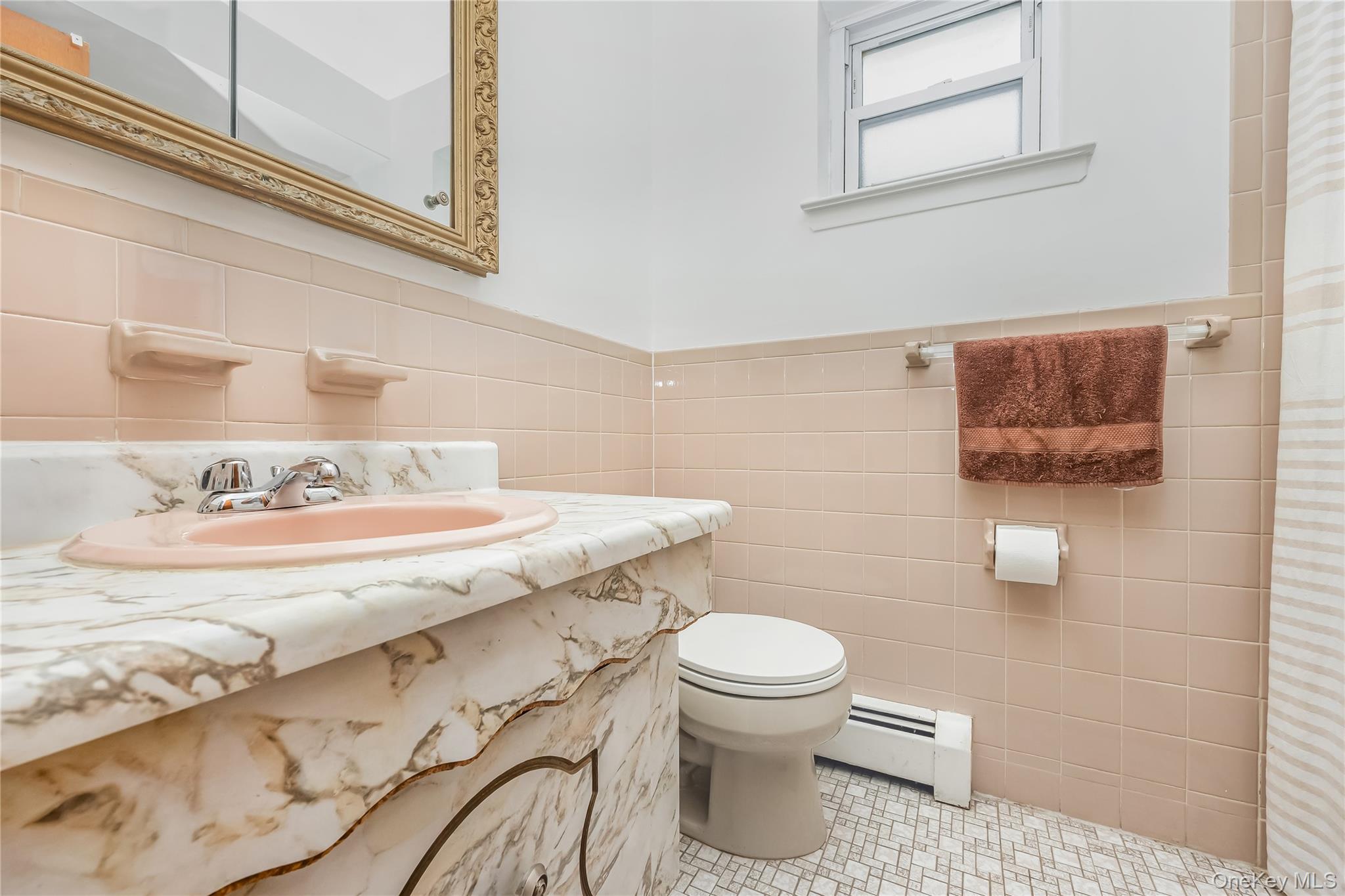 71-59 58th Road Queens, NY 11378 - Photo 29 of 34 a bathroom with a granite countertop toilet sink and mirror