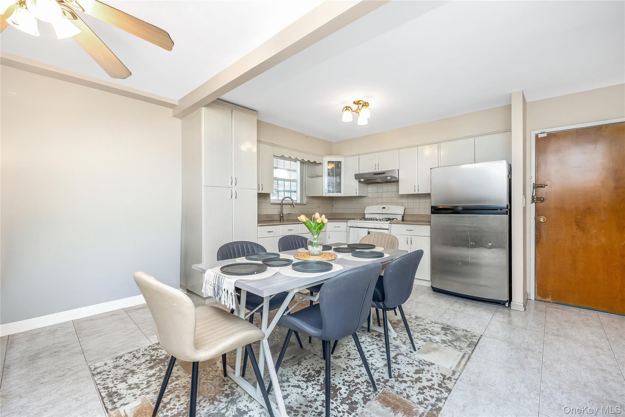 71-59 58th Road Queens, NY 11378 - Photo 3 of 34 a view of a dining room with furniture