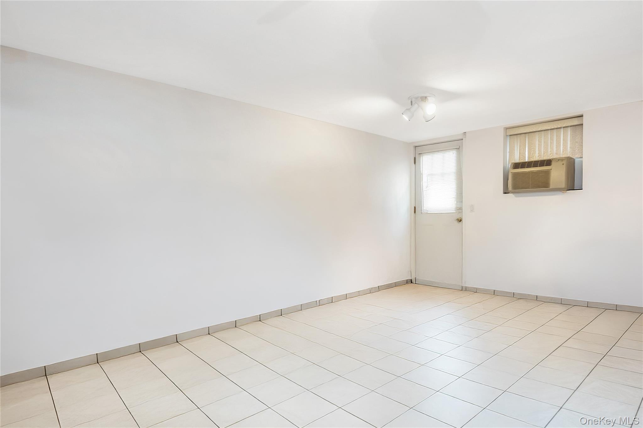 71-59 58th Road Queens, NY 11378 - Photo 32 of 34 a view of an empty room