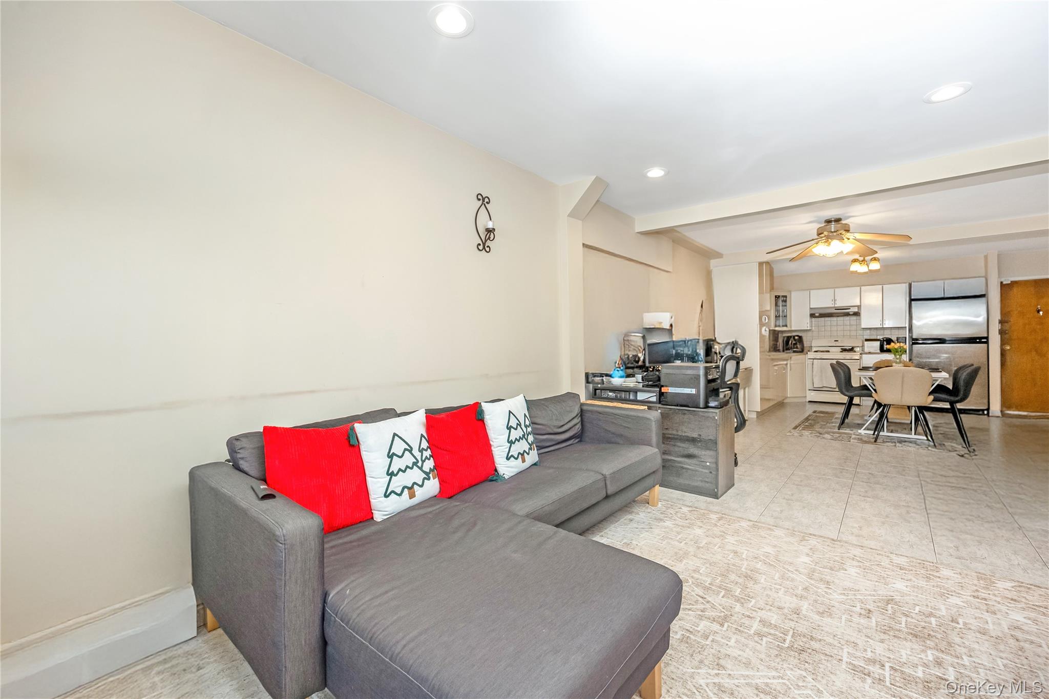 71-59 58th Road Queens, NY 11378 - Photo 6 of 34 a living room with furniture and kitchen view