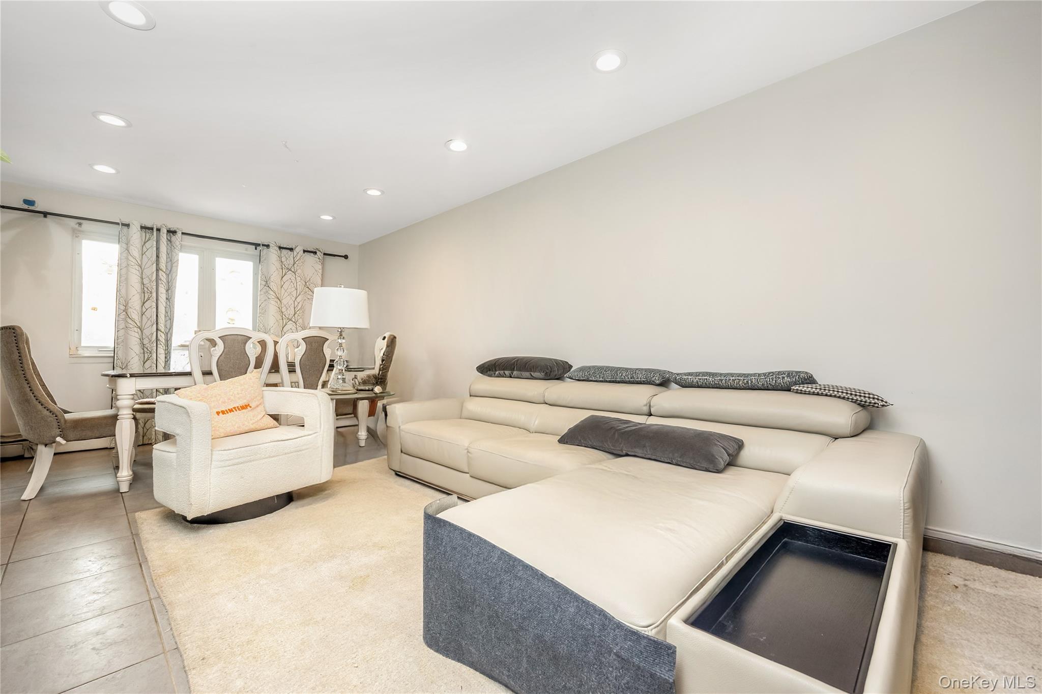 71-59 58th Road Queens, NY 11378 - Photo 9 of 34 a living room with furniture and a couch