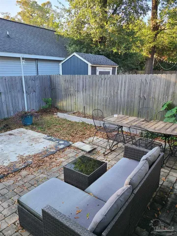 a view of a backyard with a patio