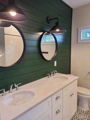 a bathroom with a sink and mirror