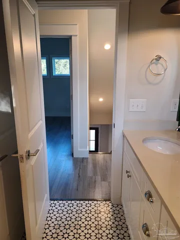 a bathroom with a sink and a mirror