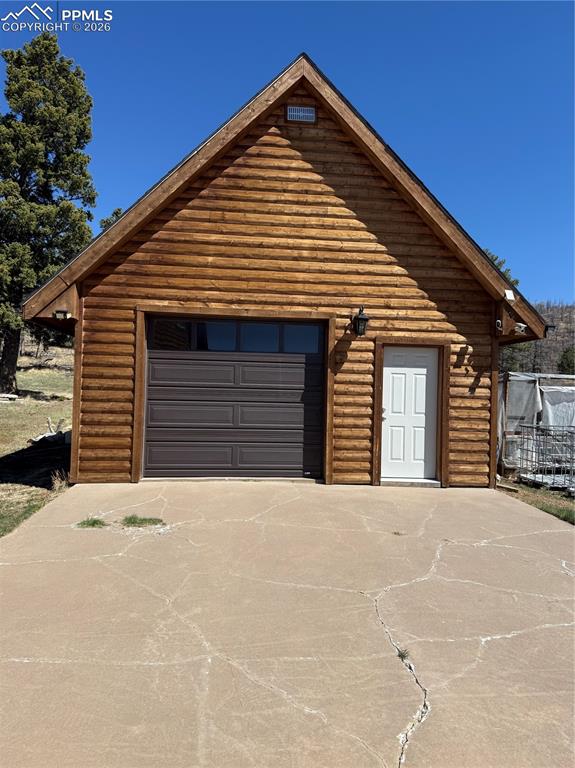 450 Schierl Road Fort Garland, CO 81133 - Photo 18 of 40 a front view of a house with a garage