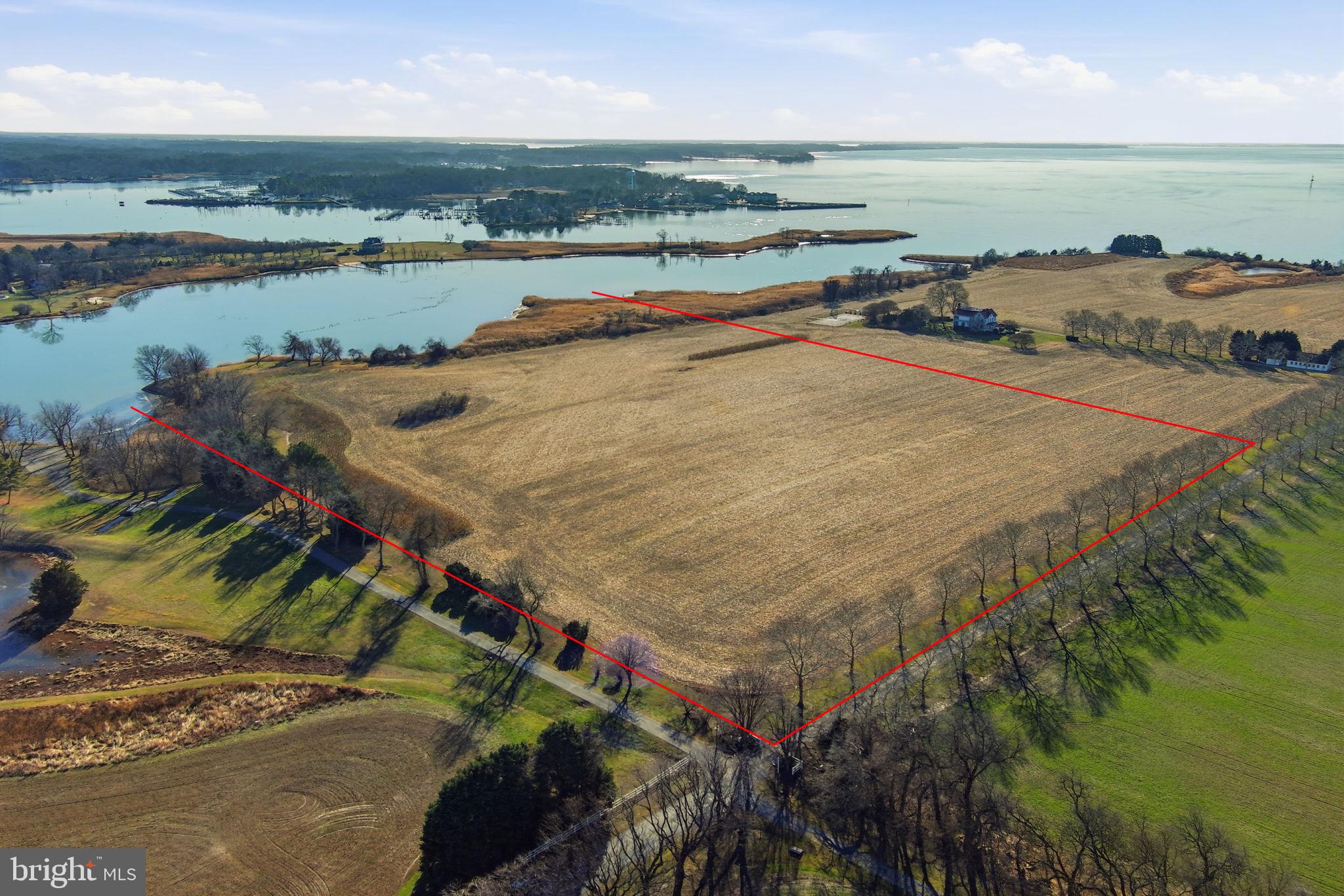 an aerial view of ocean and residential houses with outdoor space and ocean view