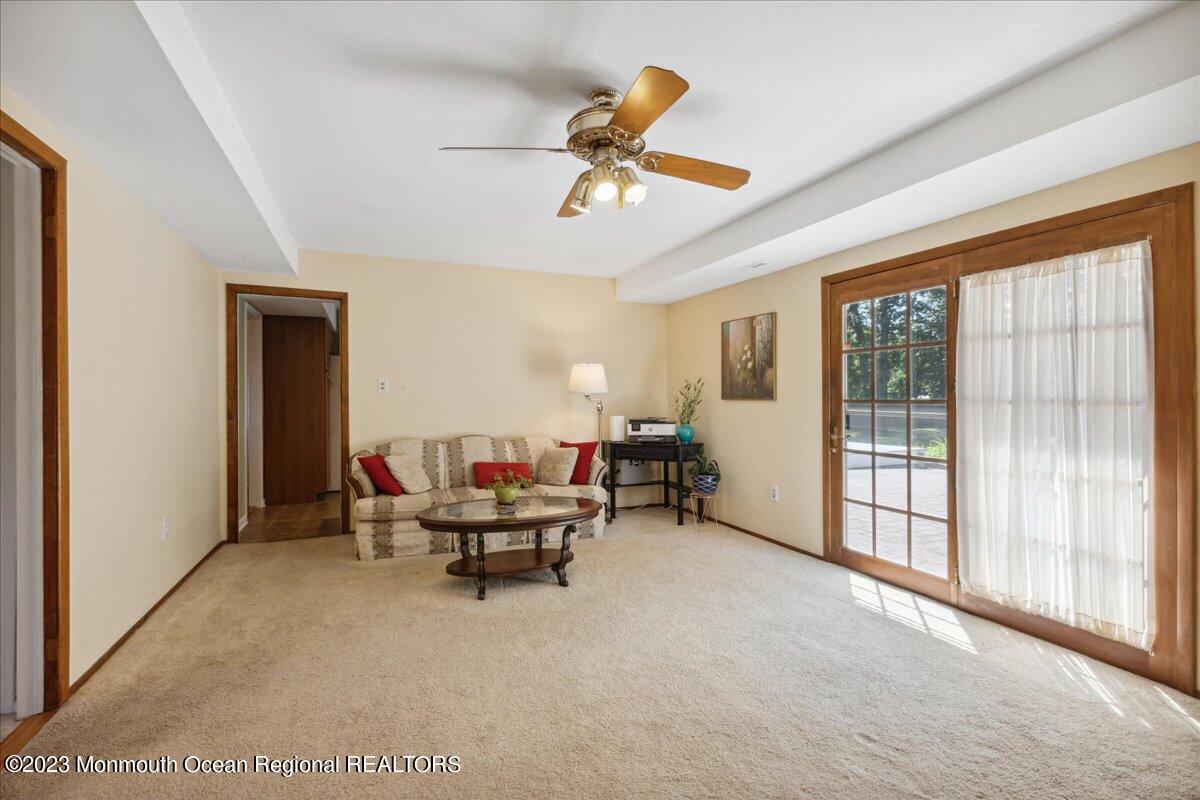 136 Lancaster Road Freehold, NJ 07728 - Photo 16 of 44 a living room with furniture and a window